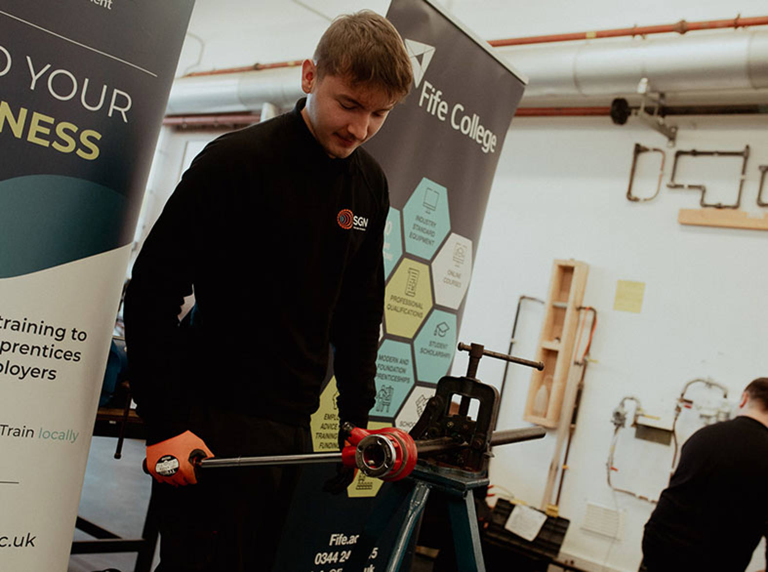 staff member behind desk at event