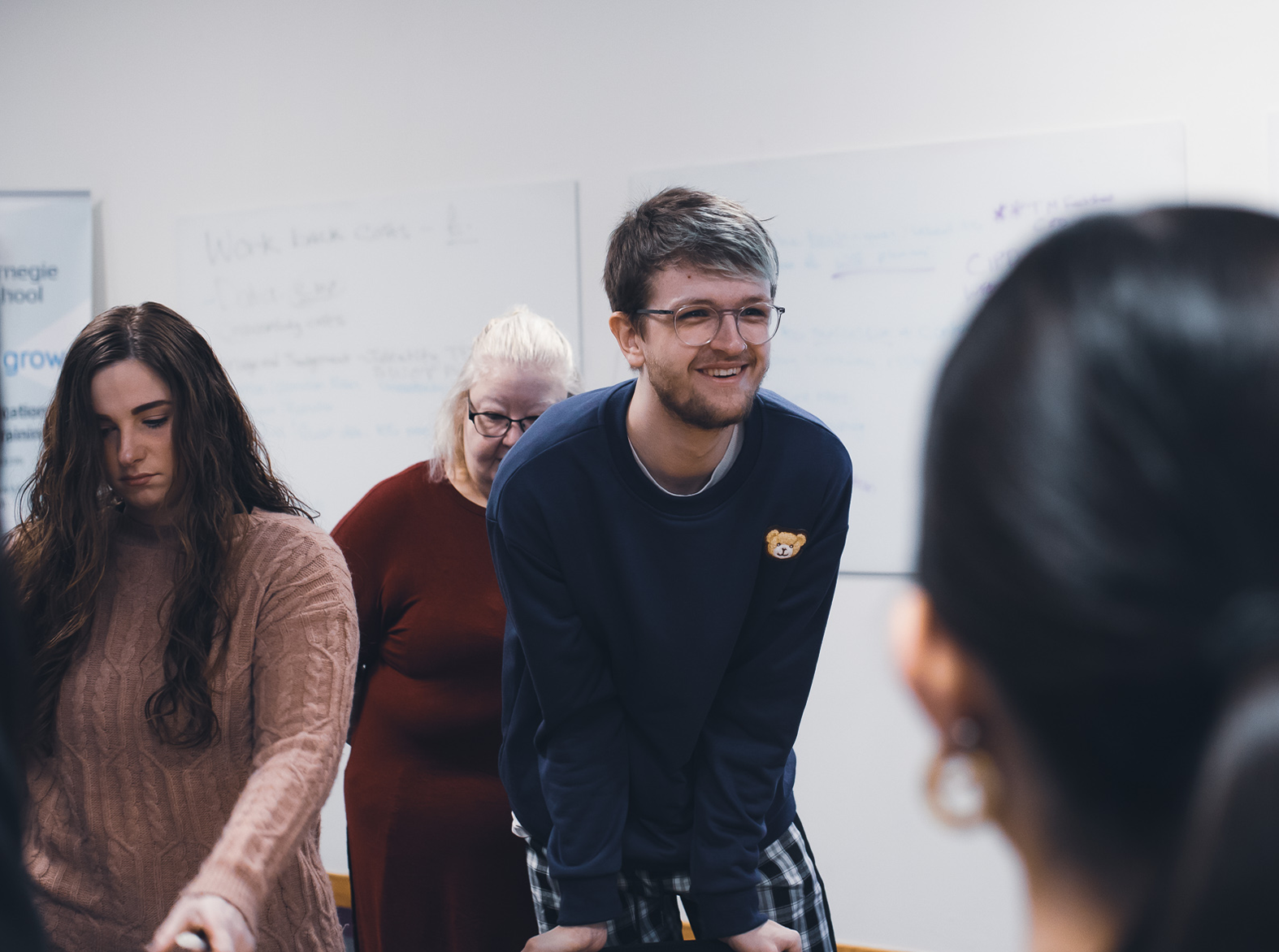 childcare male student smiling in class