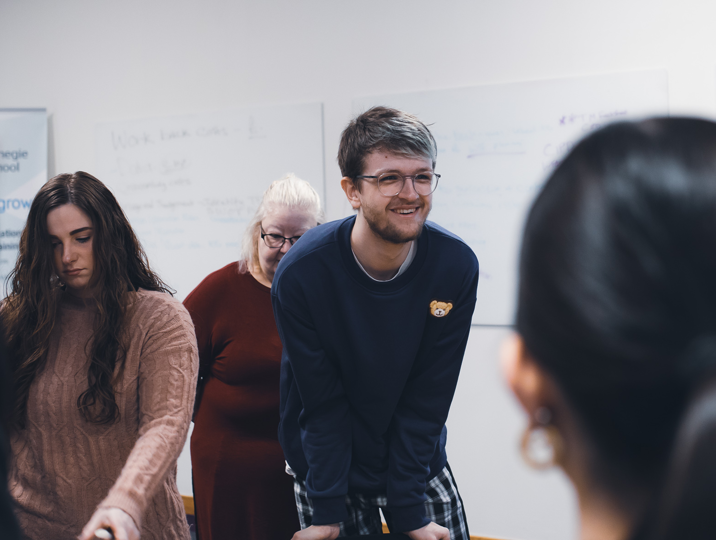 childcare male student smiling in class