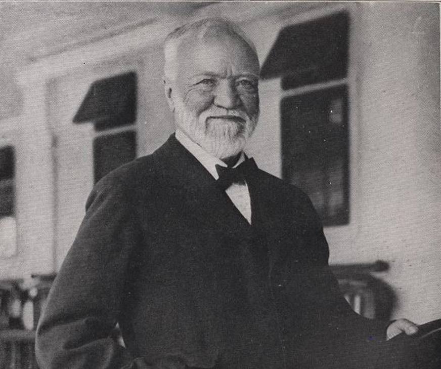 andrew carnegie smiling at camera in black and white photo