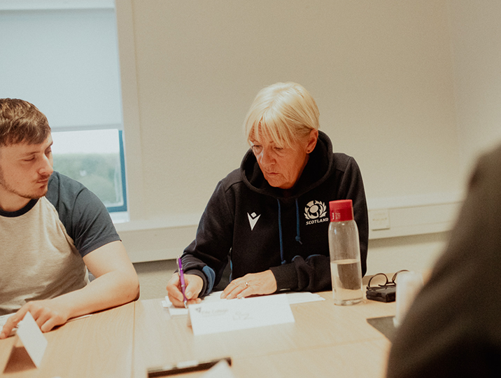 female business student writing