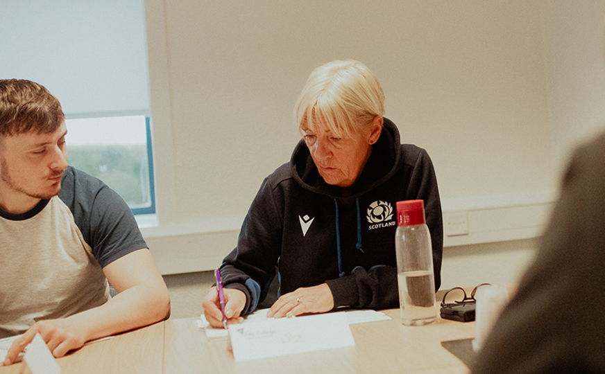 female business student writing