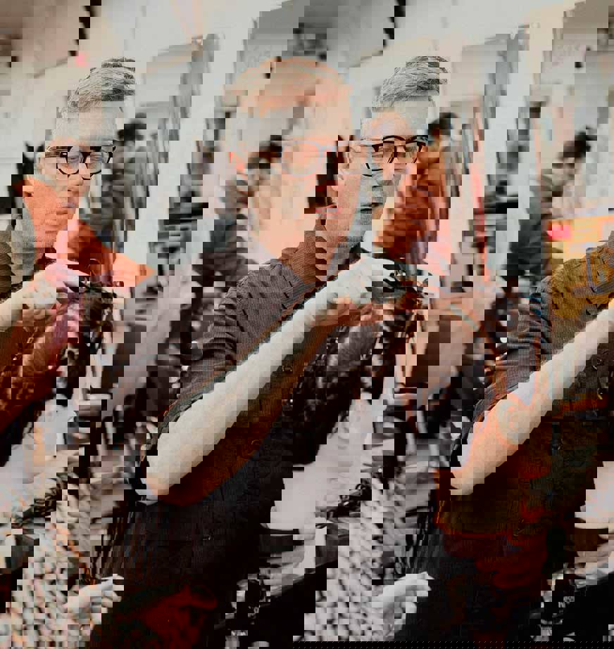 hairdresser cutting hair on mannequin