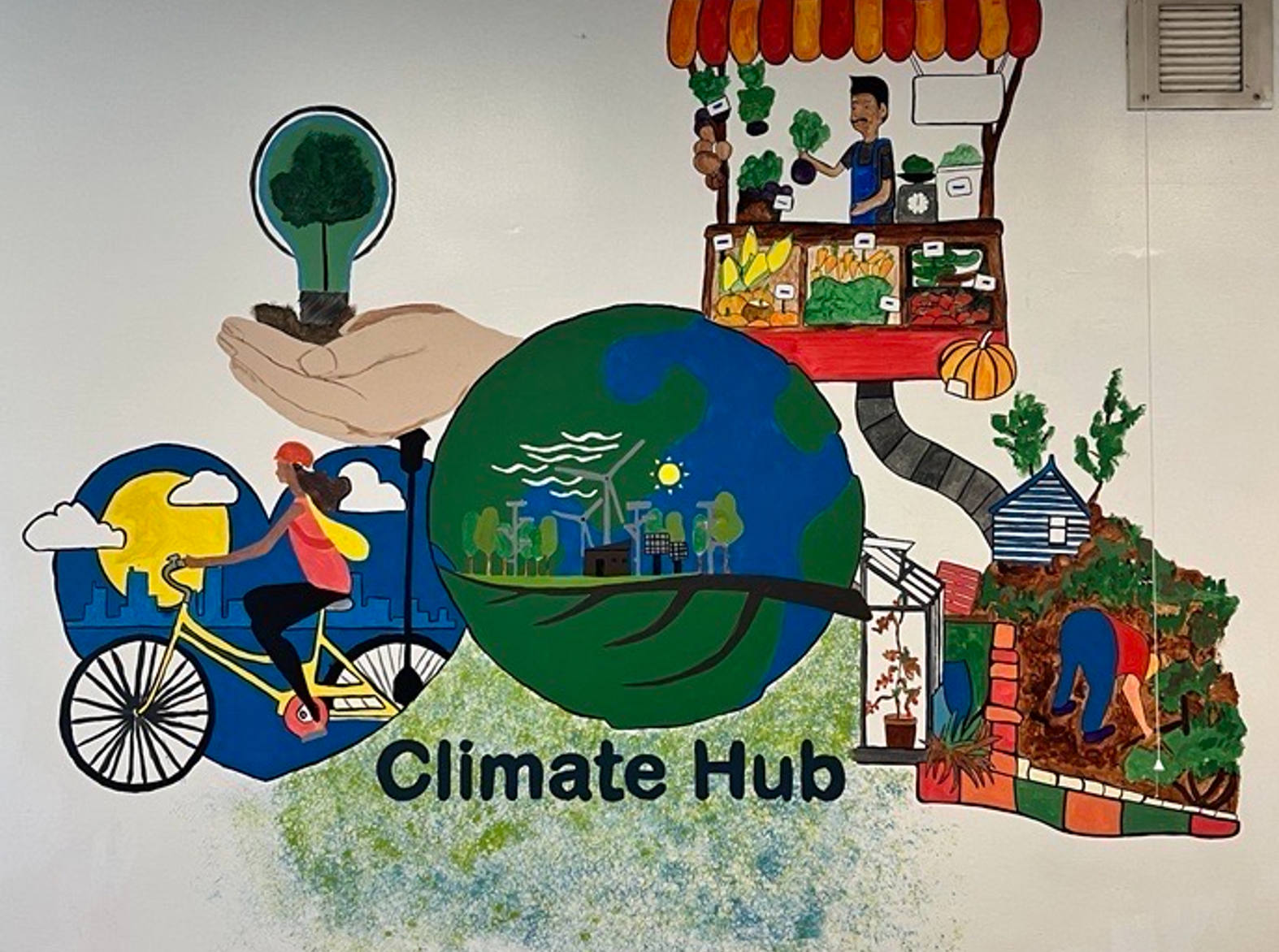climate hub mural with colourful drawings of sustainable related images