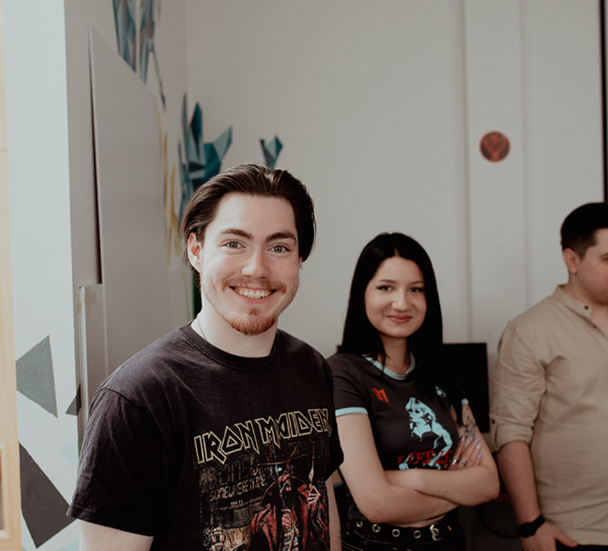 gaming students smiling at camera