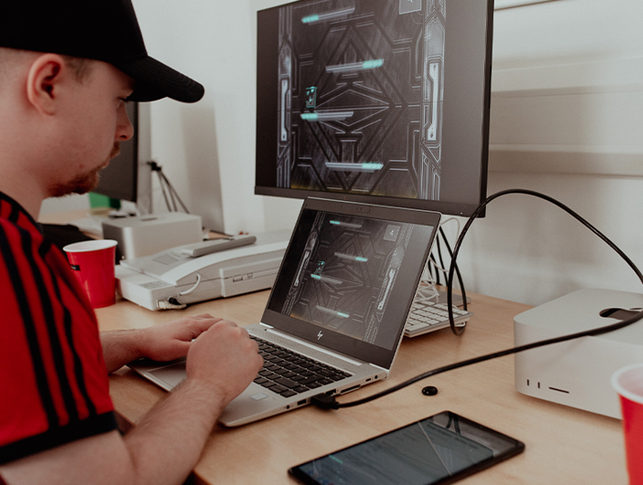 male digital student working on computer