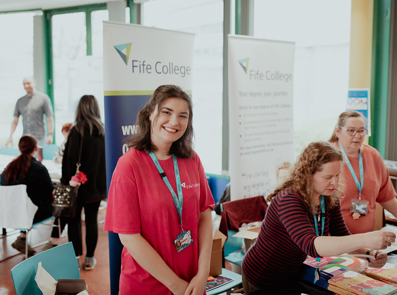 staff member behind desk at event