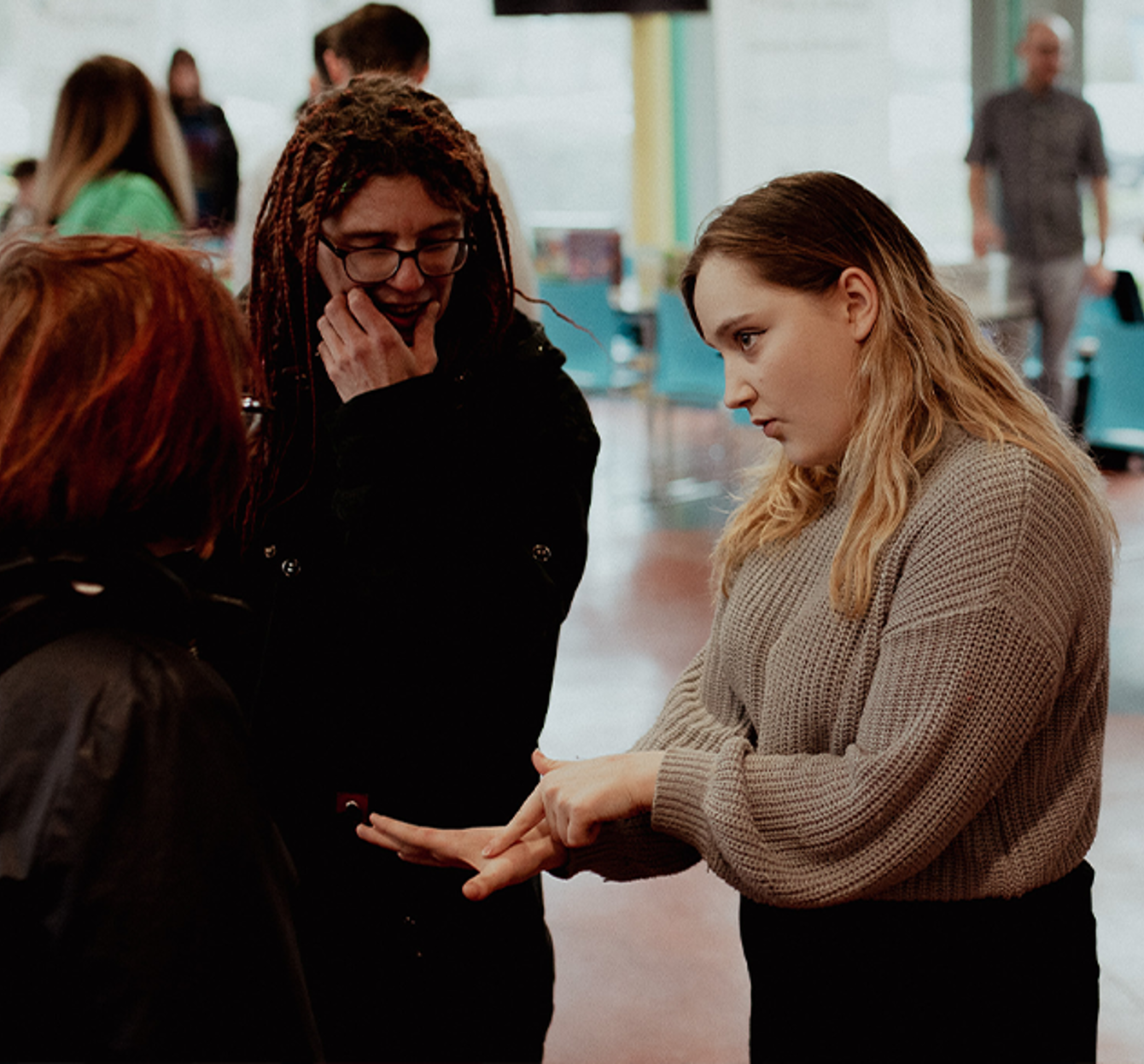 three students talking to each other in glenrothes refectory