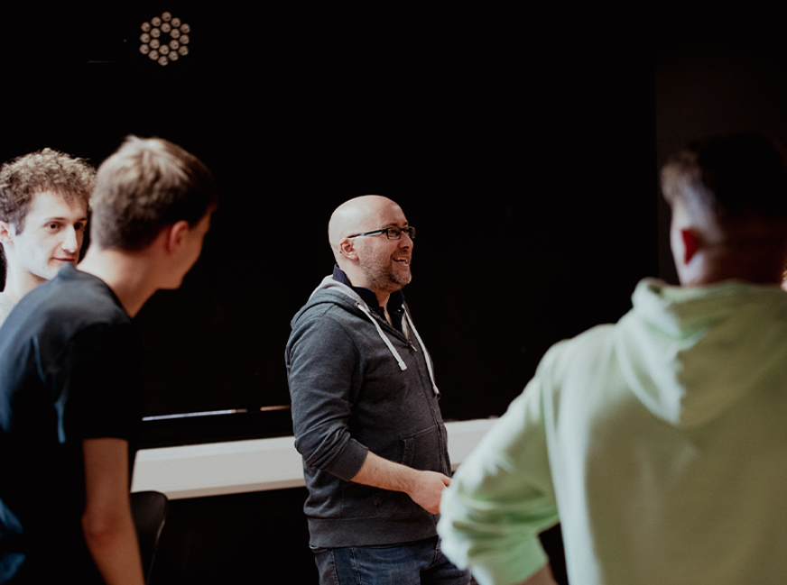 drama lecturer teaching students